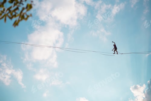 Preview: Highliner On The Background Of Blue Sky Makes A Move. A Man Is Walking Along A Stretched Sling