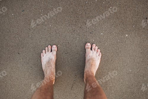 Preview: Man'S Feet On The Background Of Yellow Sand On The Beach