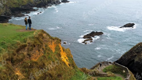 Preview: Aerial View Over A Couple Standing At Dunquin Pier On The West Coast Of Ireland