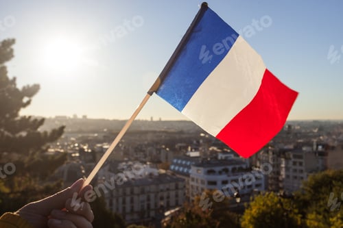 Preview: The Flag Of France On Background Of The View Of Paris From Sacre Coeur Basilica In France In Sunset