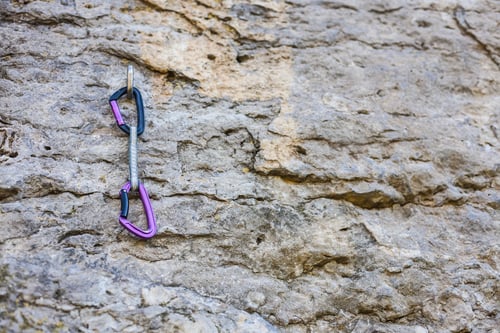 Preview: Quickdraw On The Rock. Climbing Equipment. Rope And Carbine On The Rock. Mountaineering Equipment