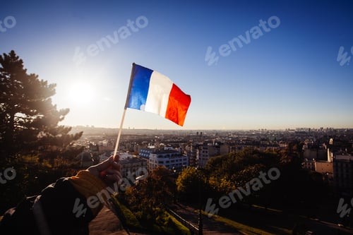 Preview: The Flag Of France On Background Of The View Of Paris From Sacre Coeur Basilica In France In Sunset