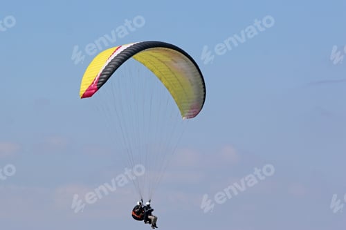 Preview: Tandem Paraglider Flying Wing In A Blue Sky