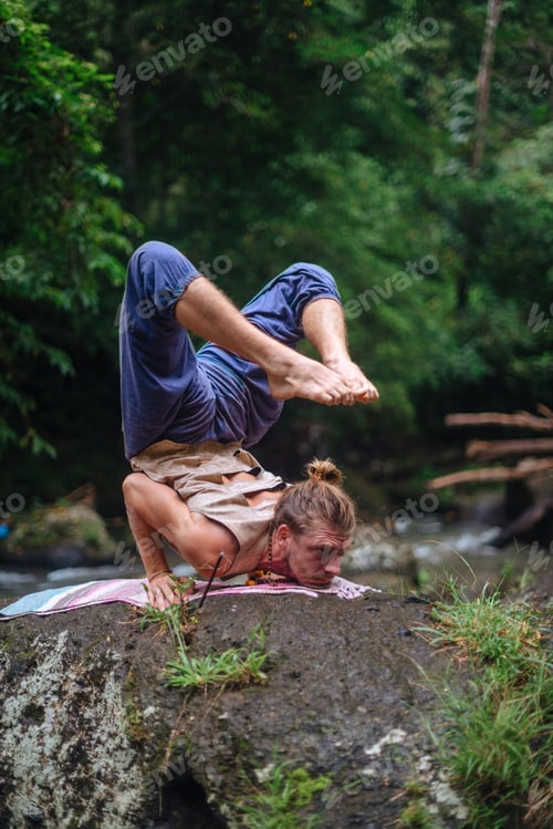 Preview: Yoga Practice And Meditation In Nature. Man Practicing Near River.