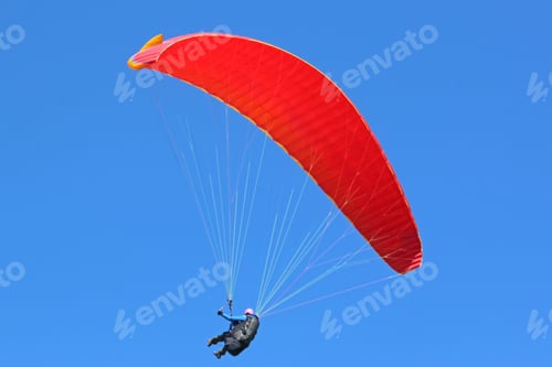 Preview: Paraglider Flying In A Blue Sky