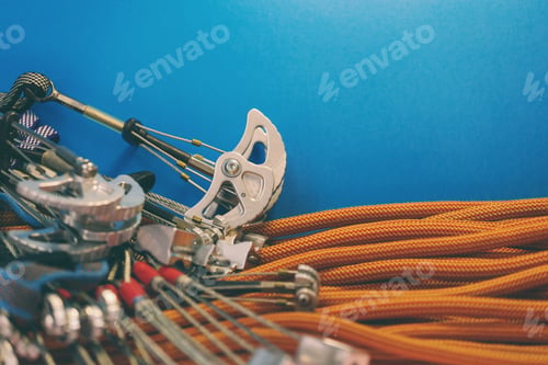 Preview: Climbing Equipment Folded On An Orange Rope. Modern Equipment For Climbing In The Mountains
