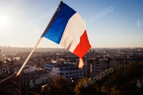 Preview: The Flag Of France On Background Of The View Of Paris From Sacre Coeur Basilica In France In Sunset