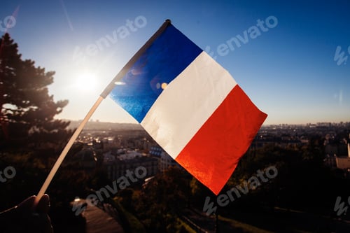 Preview: The Flag Of France On Background Of The View Of Paris From Sacre Coeur Basilica In France In Sunset