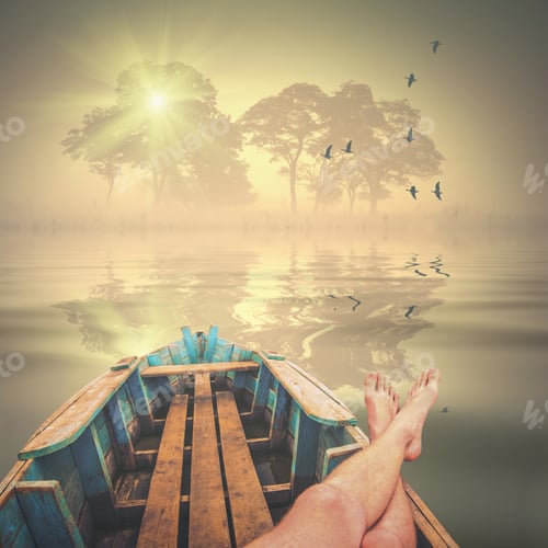 Preview: Man Lays In A Wooden Boat And Enjoy The Foggy Morning With Misty Silhouette Of Trees And Flock Of