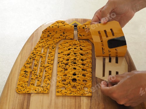 Preview: Man Apply A New Traction Pad For Surfboard.