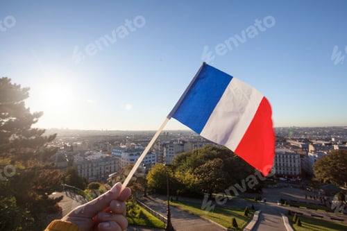 Preview: The Flag Of France On Background Of The View Of Paris From Sacre Coeur Basilica In France In Sunset