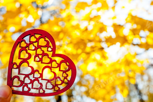 Preview: Red Heart On The Autumn Yellow Trees And Sky Background