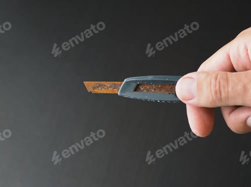 Preview: Bad Rusty Clerical Knife In A Man`S Hand. Selective Focus.