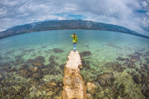 Preview: A Woman Stands On A Stone Pier. The Girl Looks At The Sea Water. Holidays In Croatia. Travel To