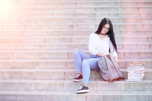 Preview: Young Girl Student On The Street With A Backpack And Books