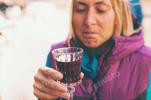 Preview: Woman Holding A Glass Of Red Wine. Cherry Brandy. Girl Tasting Alcoholic Drink. Alcohol Addiction.
