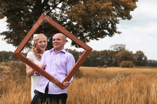 Preview: Just Married Lovers Walking In Field In Autumn Day