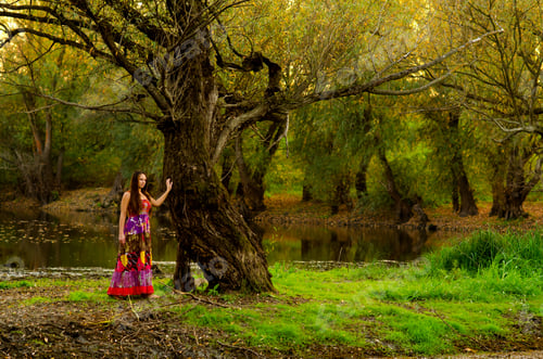 Preview: Elegant Lady Standing Beside Old Tree On Beautiful Autumn Day.