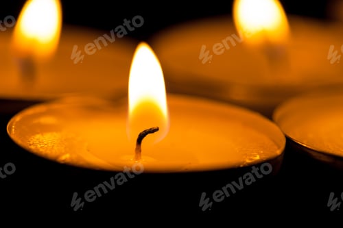Preview: Close Up View Of The Candles Cutting Through The Darkness.