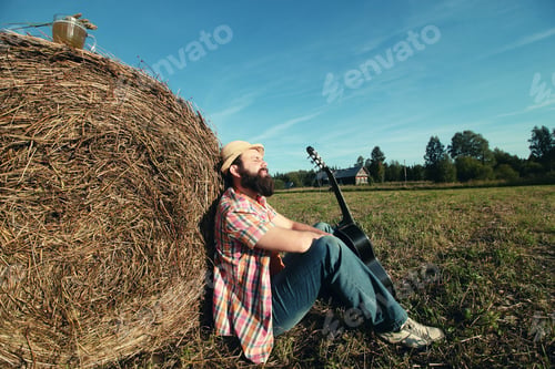 Preview: Man With Guitar And Beer On The Nature
