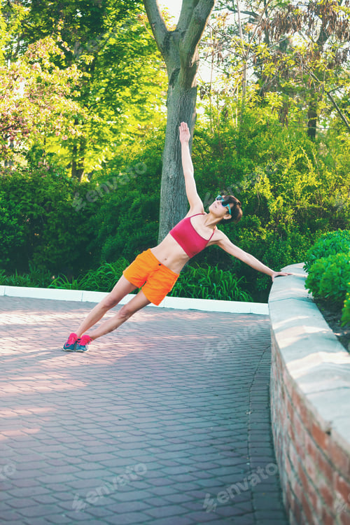 Preview: The Girl Is Engaged In Morning Yoga. A Woman Is Training In The Park. Stretching. Active Lifestyle.