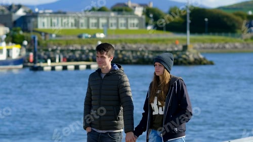 Preview: Young Couple Walks Hand In Hand Through The Harbor