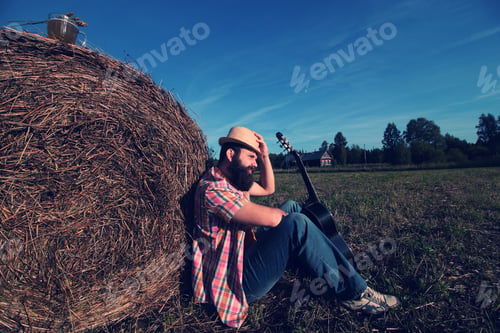 Preview: Man With Guitar And Beer On The Nature