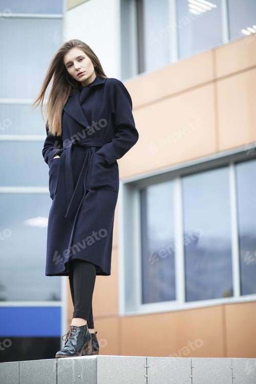 Preview: Beautiful Girl In A Coat In Business Downtown Of The Cloudy