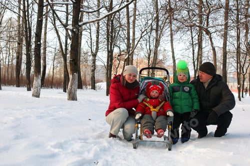 Preview: Young Family With Children On A Walk In The Park In Winter