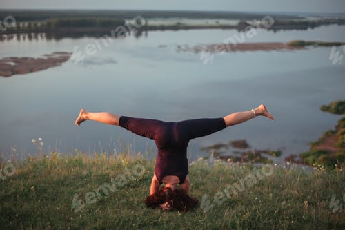 Preview: Yoga Practice And Meditation In Nature In Sunrise. Woman Practicing Near Big River Kama