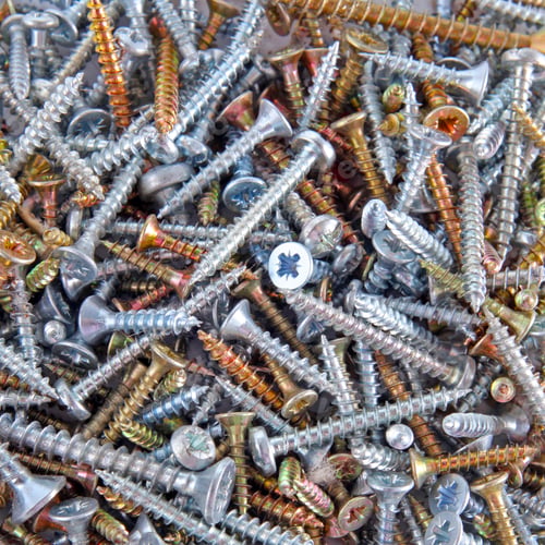 Preview: Box With Silver And Golden Screws Close-Up Background
