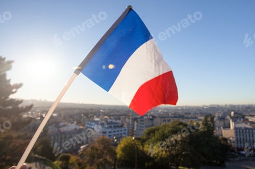 Preview: The Flag Of France On Background Of The View Of Paris From Sacre Coeur Basilica In France In Sunset