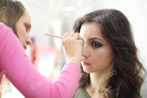 Preview: Beautiful Girl Doing Makeup In Front Of A Mirror