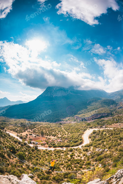Preview: A Man Is Walking Along A Stretched Sling. Highline In The Mountains. Man Catches Balance