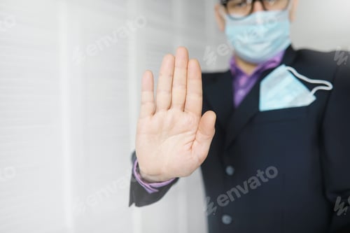 Preview: A Disposable Medical Mask Sticks Out Of A Pocket Instead Napkin. A Man With A Disposable Mask In A