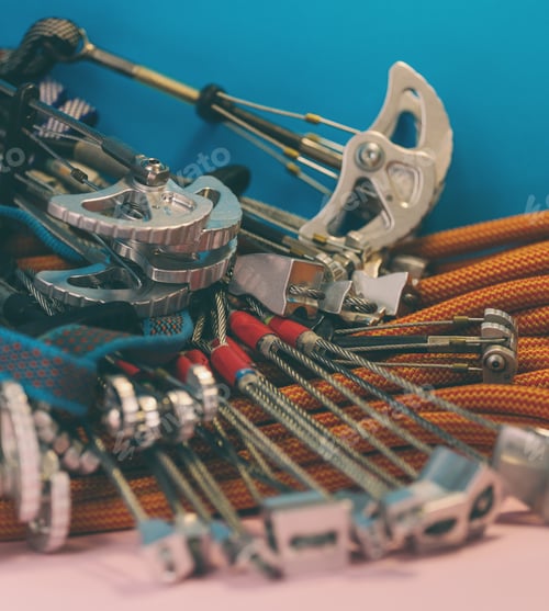Preview: Climbing Equipment Folded On An Orange Rope. Modern Equipment For Climbing In The Mountains