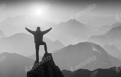 Preview: Hiker Standing On A Peak Of Mountain With Raised Hands And Rejoices Sunrise Above The Misty Valley
