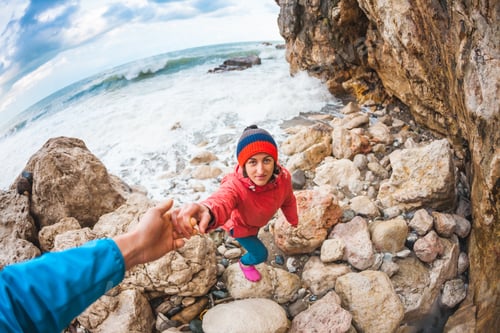 Preview: Helping Hand. A Man Helps A Girl To Climb A Stone. Help A Friend. A Woman Travels With A Partner.