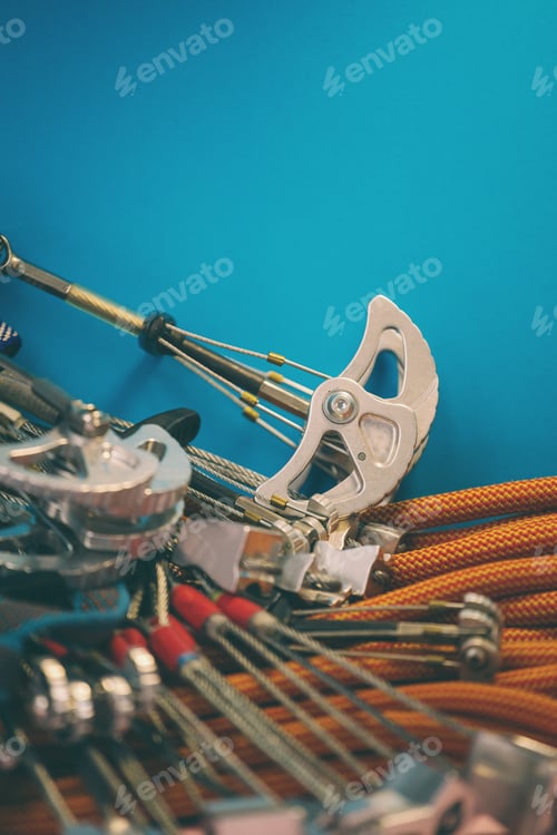 Preview: Climbing Equipment Folded On An Orange Rope. Modern Equipment For Climbing In The Mountains