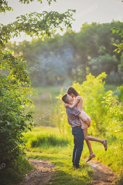 Preview: Young Couple In Love Together On Nature In Summer