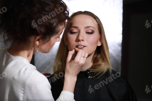 Preview: Young Girl With A Make-Up Artist In The Studio In Front Of A Mirror