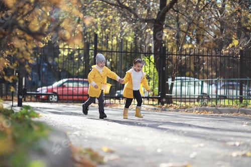 Preview: Children Walk In The Autumn Park In The Fall