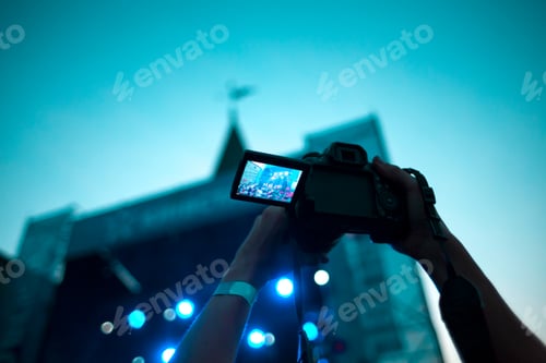 Preview: Shooting A Concert On A Smartphone. The Image On The Display Of The Gadget. Music Band On Stage