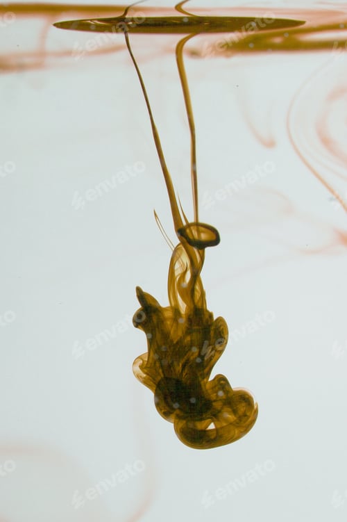Preview: Yellow Liquid In Water Making Abstract Forms