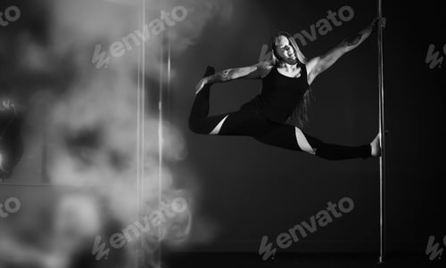 Preview: Girl Doing Exercises On A Sports Equipment. The Dancer On The Pylon In The Studio.