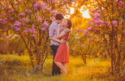 Preview: Portrait Of Young Couple In Flowering Park