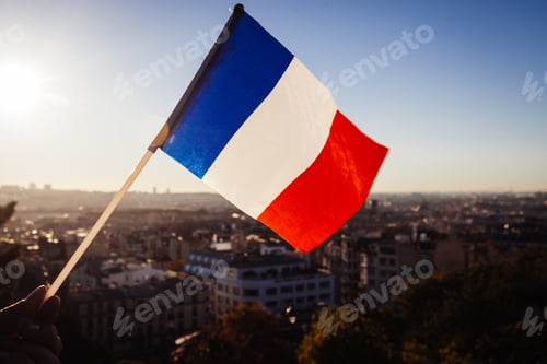 Preview: The Flag Of France On Background Of The View Of Paris From Sacre Coeur Basilica In France In Sunset