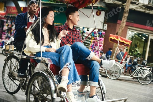 Preview: Wide Shot Of Couple Traveling By Vietnamese Pedicab