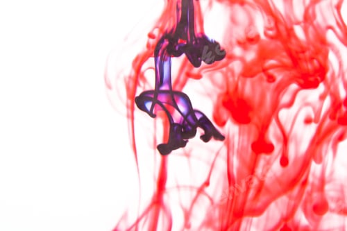 Preview: Red And Violet Liquid In Water Making Abstract Forms