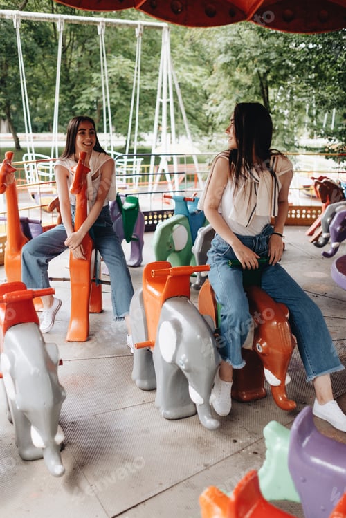 Preview: Portrait Of Two Young Brunette Twins Sisters Dressed Alike In Jeans And White T-Shirt, Best Friends